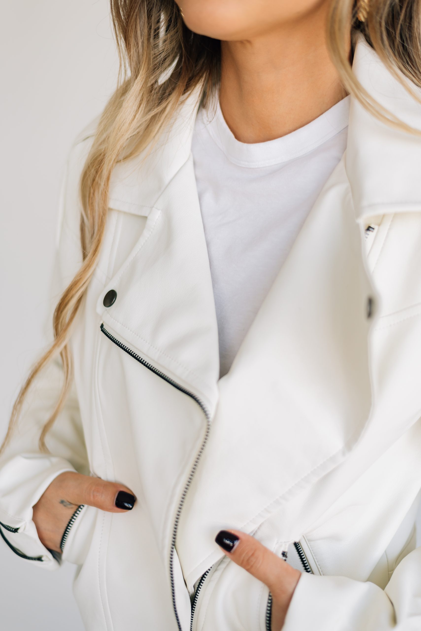 Black moto jacket with slits, perfect for an edgy look