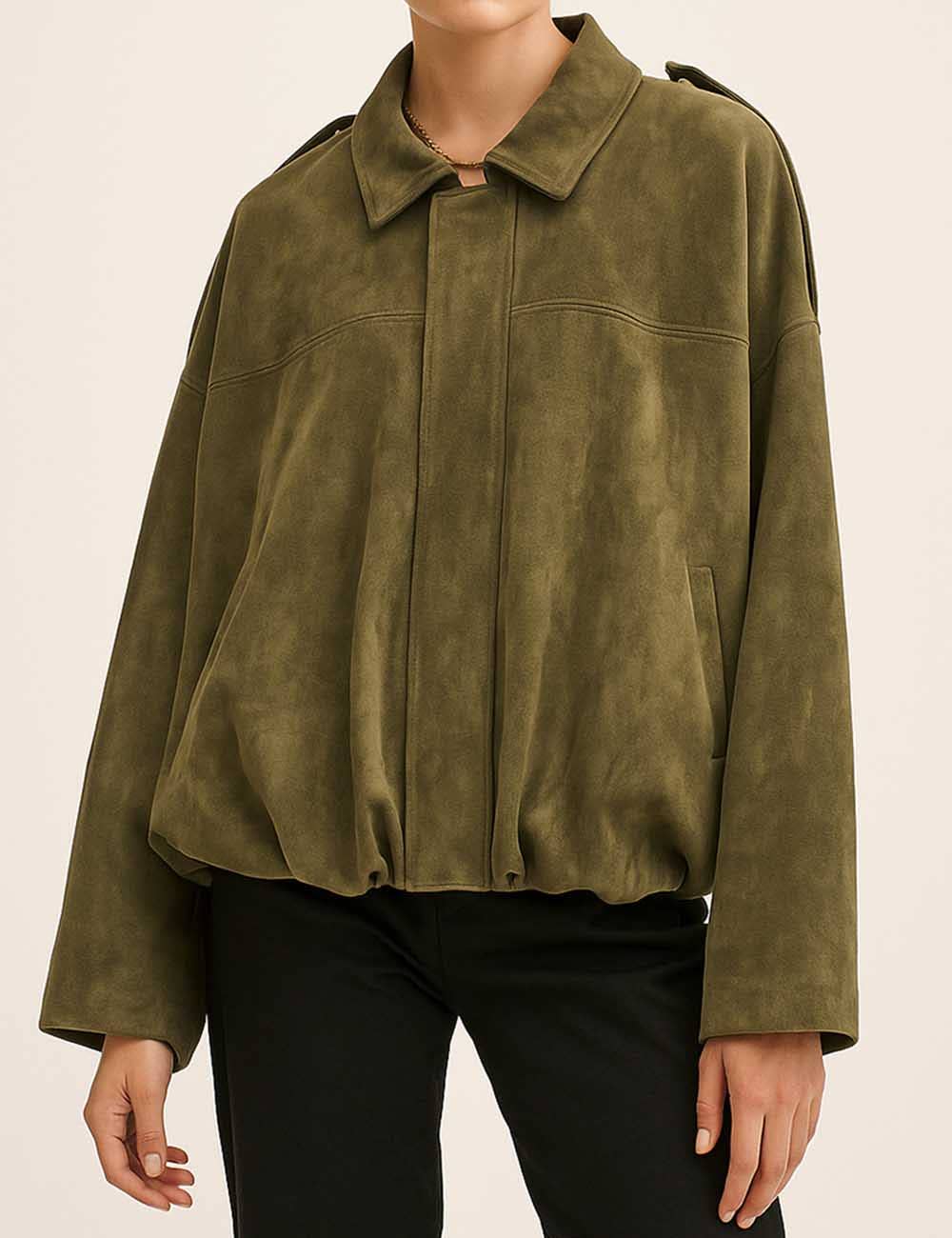 army green suede jacket worn by a person on a beige background
